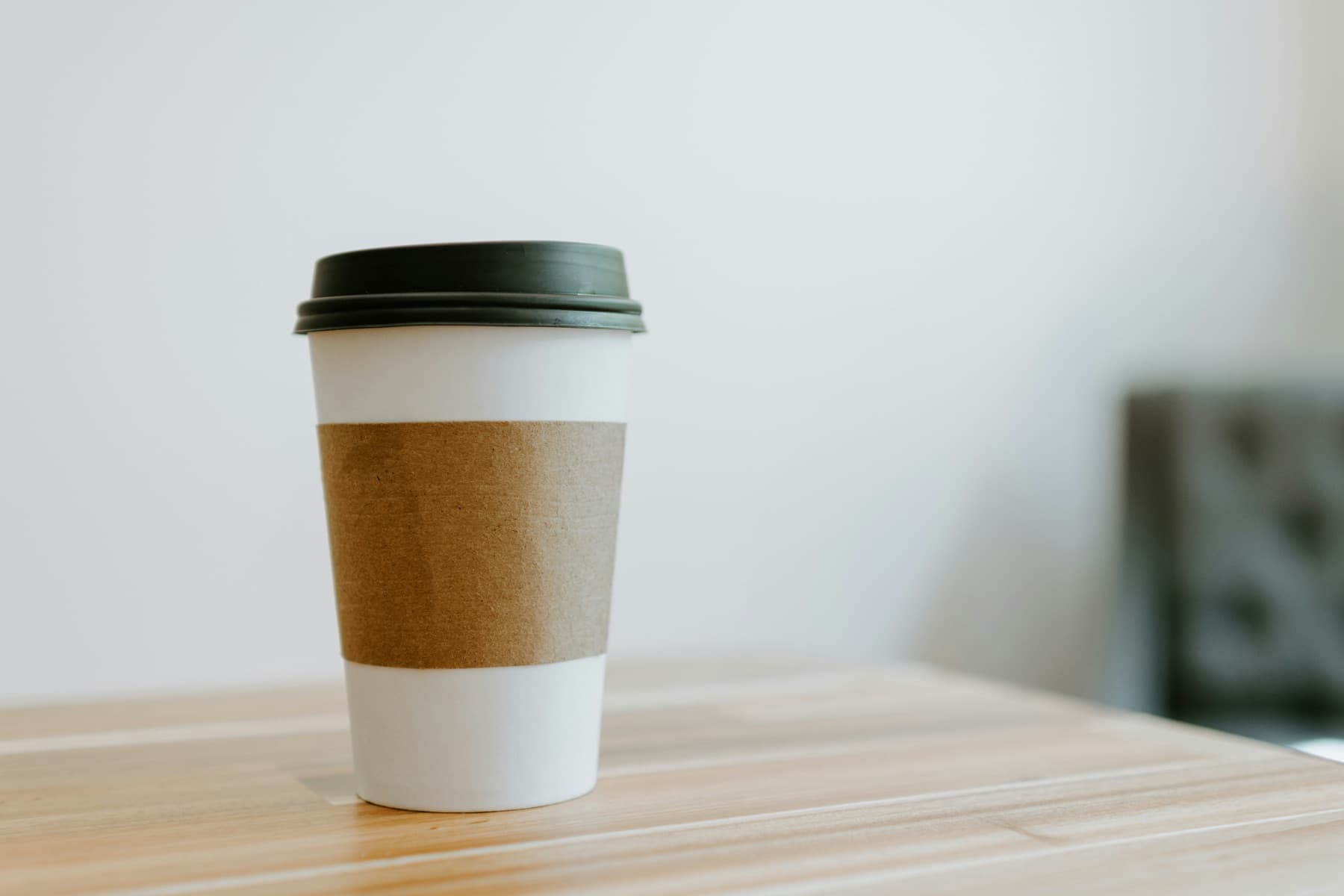 A fresh cup of coffee on a sunlit table — a moment to pause and recharge during the workday
